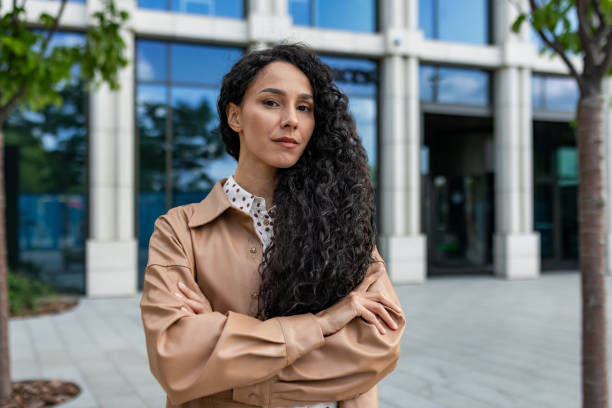 istock Confident professional woman standing outside modern building 2107734705