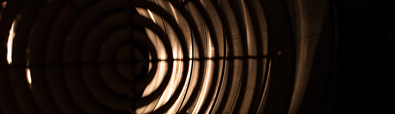 round ventilation grille at night in backlight. front and back background blurred with bokeh effect