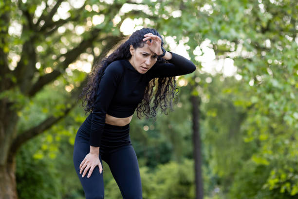 istock Athletic woman taking a break during outdoor workout 2107854934