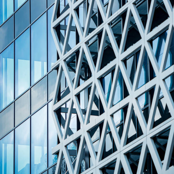 istock Modern Business Building with Glass Facade with Metal Triangles in Luminescent Elegance 2107879426