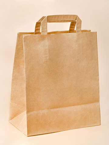 Brown Paper Packet on Neutral Background: Environmentally-Friendly Packaging Option
