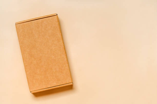 Sustainable Box: Overhead Shot of Cardboard Carton on Neutral Surface