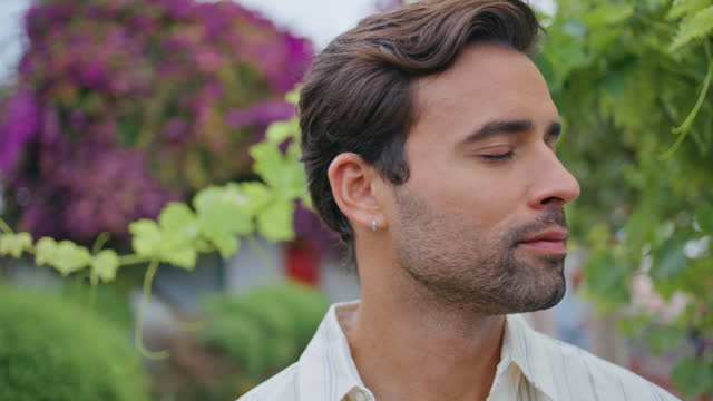 Romantic man looking distance near grape bush closeup. Latin macho portrait