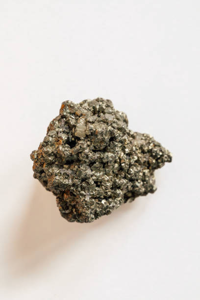 istock pyrite, fool's gold on white 2107998626