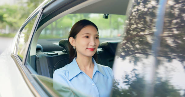 istock woman passenger sit in taxi 2108122996