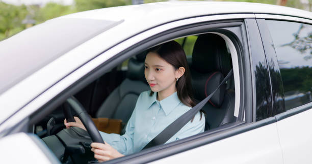 istock asian woman fasten seat belt 2108124035