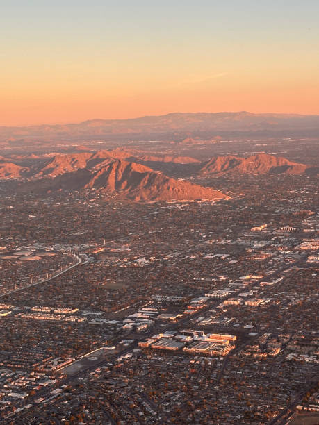 istock flying over Phoenix, Arizona at dawn 2108140028