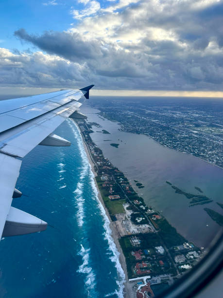 istock flying into Palm Beach, Florida at dawn 2108156206