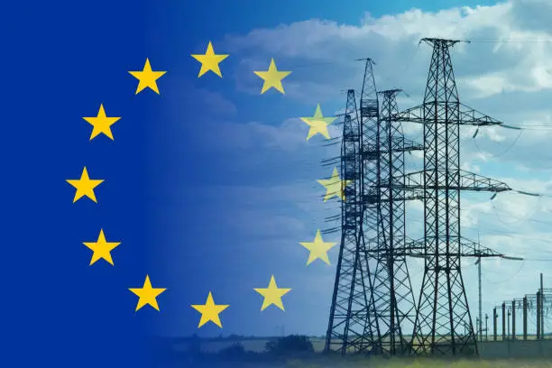 European union flag and electricity pylon mixed image. Expensive electricity concept. High costs for energy.