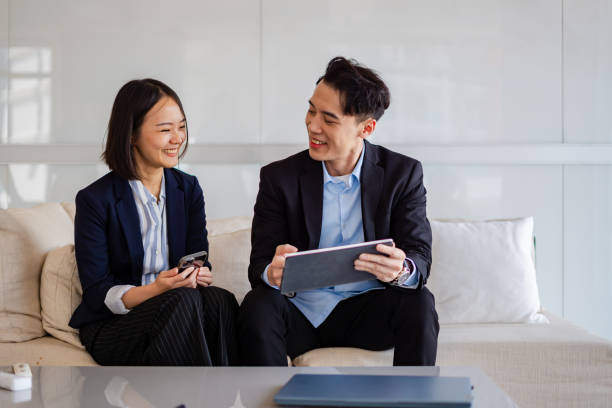 istock Focused Conversations: Young Asian Leader and Advisors Brainstorm in Office Setting 2108328637