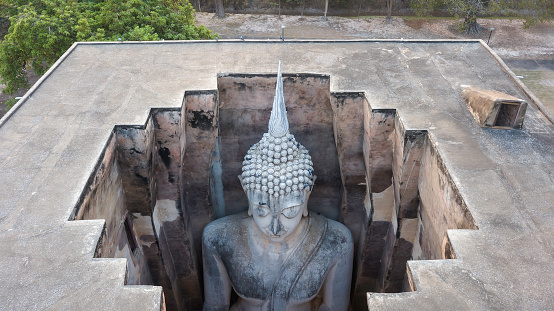 Wat Si Chum temple and big Buddha in Sukhothai historical park, Thailand