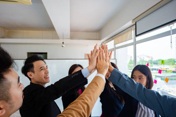 istock Solidarity in Success: Business Team Embracing Unity 2108343069