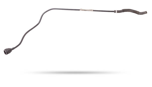 Black plastic hose of the car engine cooling system on a white isolated background in a photo studio for replacement during repair or for a catalog of spare parts for sale on auto disassembly.