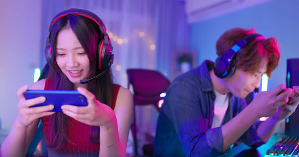 istock asian couple smartphone cyber sport 2108415335