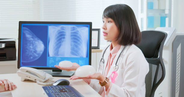 istock Asian doctor explain breast implant 2108416372