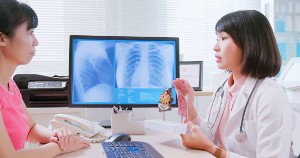 istock asian doctor explain lung illness 2108417424