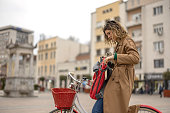 Young woman riding bicycle in the city