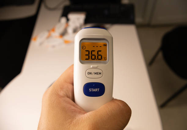 istock Infrared thermometer in latin man´s hand. 2108460250