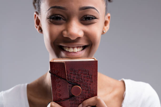 istock Broad smile, treasured book, stories spark imagination 2108473832