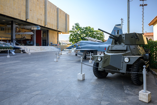 Armored personnel carrier near metal fence - view from the back