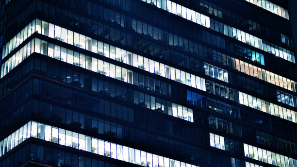 istock Office buildings by night. Night architectural, buildings with glass facade. 2108570783