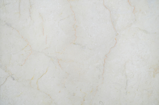 Close-up shot of White yellowish marble textured flooring
