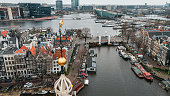 Aerial view of Montelbaanstoren Clock Tower in Amsterdam, Montelbaanstoren tower in Amsterdam, aerial city view of Montelbaanstoren Tower, aerial view of narrow canals of Amsterdam, popular place in Amsterdam
