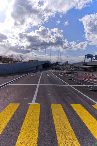 istock Empty new motorway exit with yellow zebra crossing in the foreground at Swiss town. 2108642955