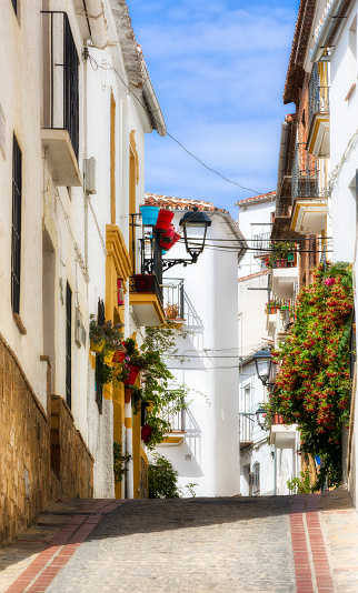 Street in the white city of Jubrique in Andalusia, Spain