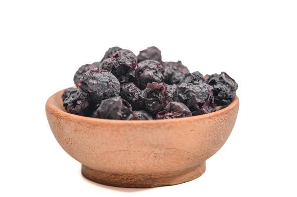 Isolated dried berries on white background, freeze-dried blueberries