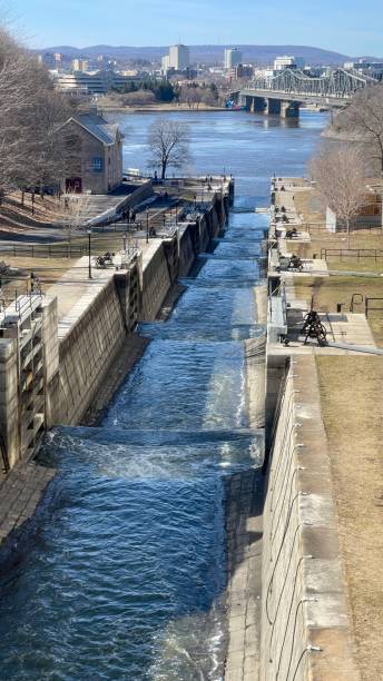 Ottawa, Canada - May 16, 2024: Rideau canal locks in downtown. View on Ottawa river during sunset.