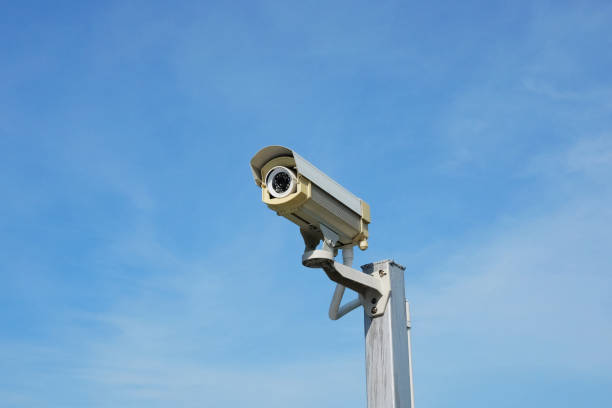 istock Closed circuit camera or CCTV camera outdoor with sunny and blue sky 2108825320