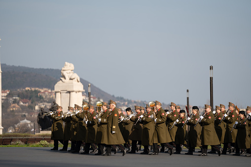 Budapest, Hungary - March 15, 2024: National day celebration near the parliament building. Military parade with military band.