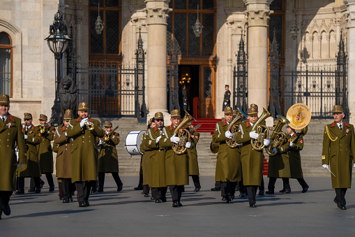 Budapest, Hungary - March 15, 2024: National day celebration near the parliament building. Military parade with military band.