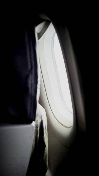 istock Light visible from the airplane window in the passenger seat 2108901492