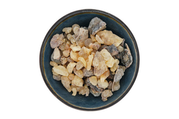 istock Frankincense from Somalia (Boswellia carterii), a tree resin, in a blue ceramic bowl 2108903023