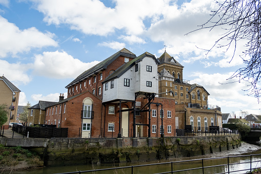 Colchester, Essex, UK  March 18 2024. The old granary, which has been converted in to flats and apartments, on the River Colne
