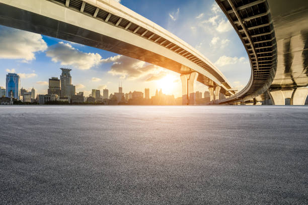 istock Asphalt road and urban buildings background 2108924587