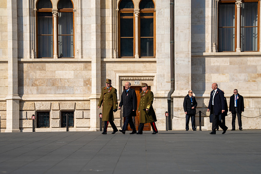 Budapest, Hungary - March 15, 2024: National day celebration near the parliament building. Military parade with. Tamas Sulyok on the middleground.