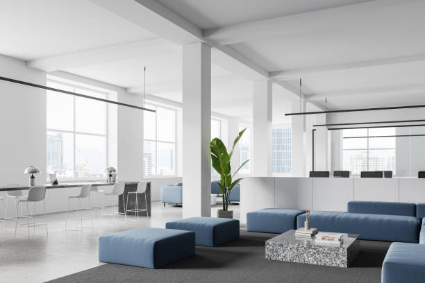 istock White office interior with coworking and lounge zone, panoramic window 2108959980