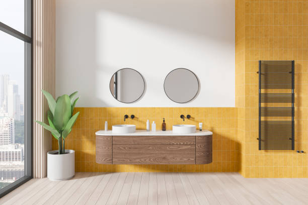 istock White and yellow bathroom interior with double sink 2108974955