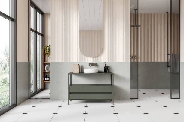 istock Stylish hotel bathroom interior with sink and glass shower with window 2108986471