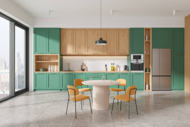 istock Green and wooden kitchen interior with table 2108989543