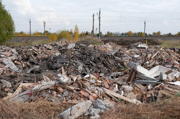 Construction waste. A pile of red broken bricks, concrete debris and rubble. Demolition rubble