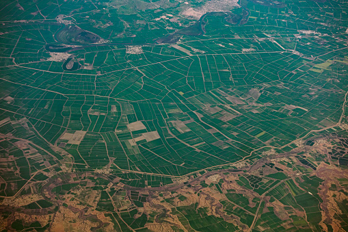 Aerial shot of Agri farmlands viewed from the airplane window