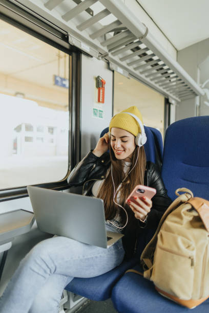 istock Listening to music while commuting by train 2109027484
