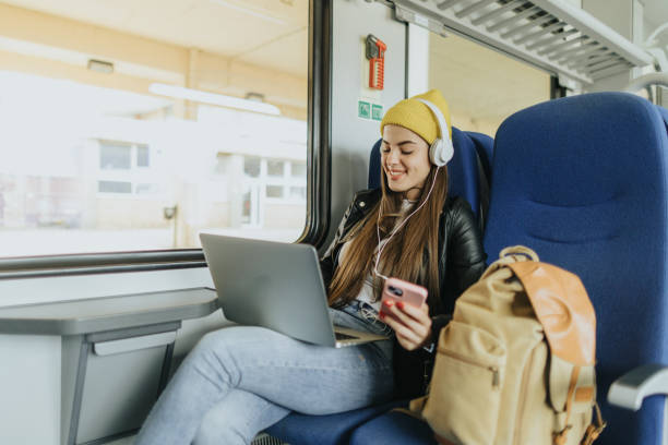 istock Listening to music while commuting by train 2109027993