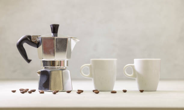 istock Metal geyser coffee maker on table with cup 2109032120
