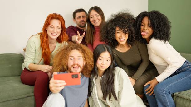 istock Multi-ethnic friends taking a selfie at home 2109050322