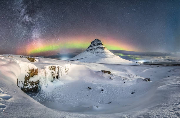 istock Kirkjufell Mountain and Waterfall under Aurora Borealis and Milky Way 2109051722